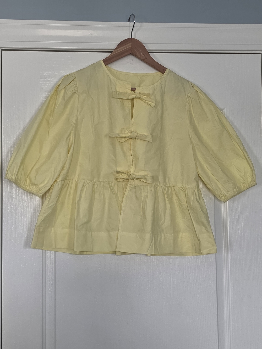 Soft Yellow Bow-Front Peplum Blouse